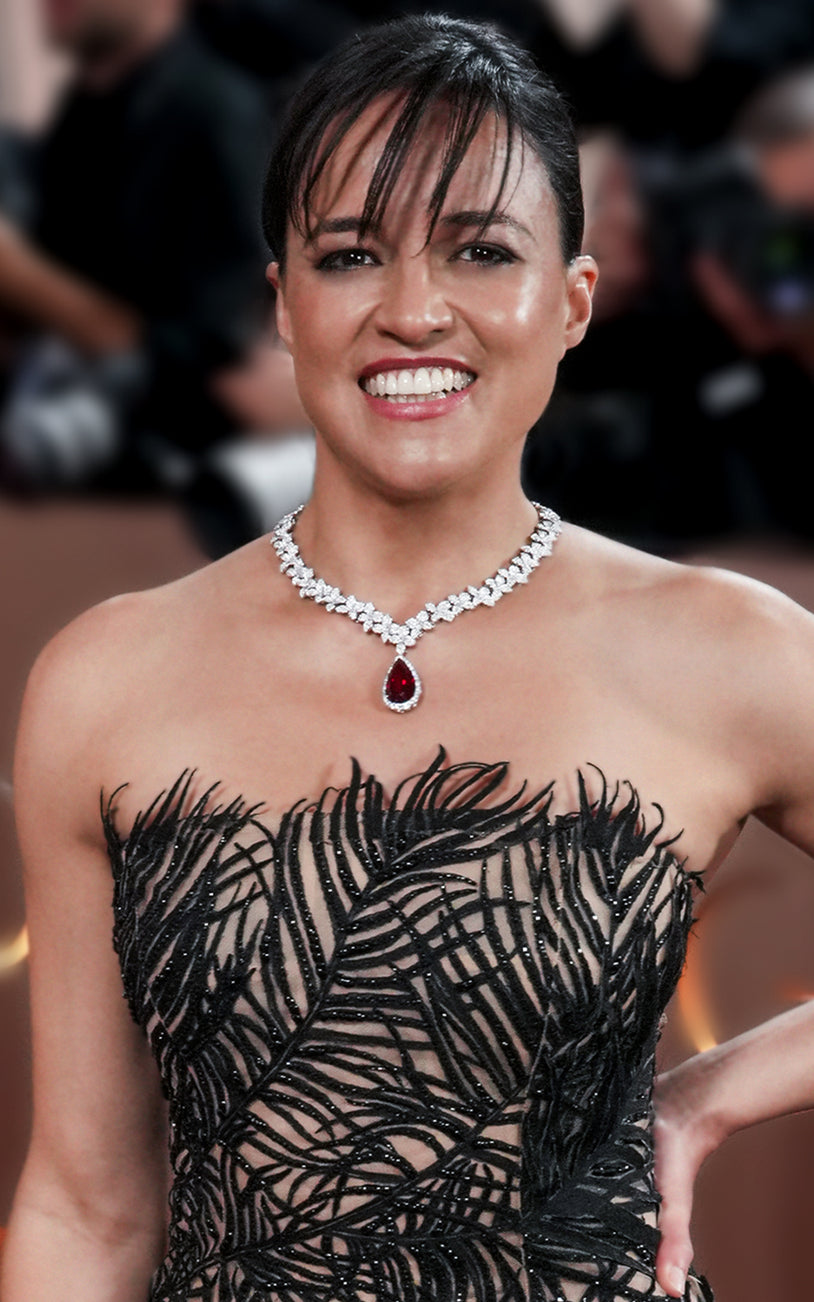 MichelleRodriguez wearing a necklace in 18k White Gold with white diamonds and a ruby drop.