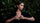 Model on a green background of green leaves with the Petit Joli collection.