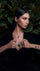 Model on a green background of green leaves with the Petit Joli collection.