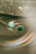 Colored Petit Joli rings on green leaves