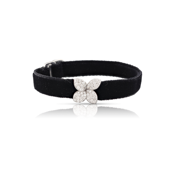 Black velvet necklace with white gold and diamond flower.